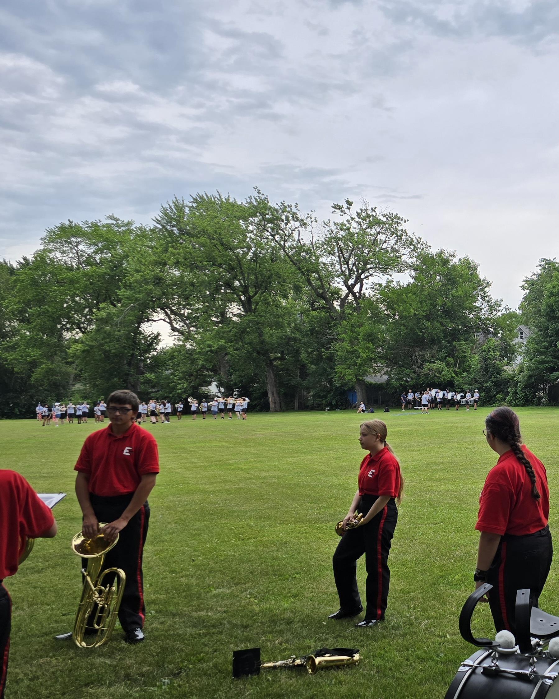 The Edison High School Band waiting to warmup and watching other bands in Scott Park for the LaPorte 4th of July Parade. Michigan City High School Band in upper left of photo. 04 July 2025