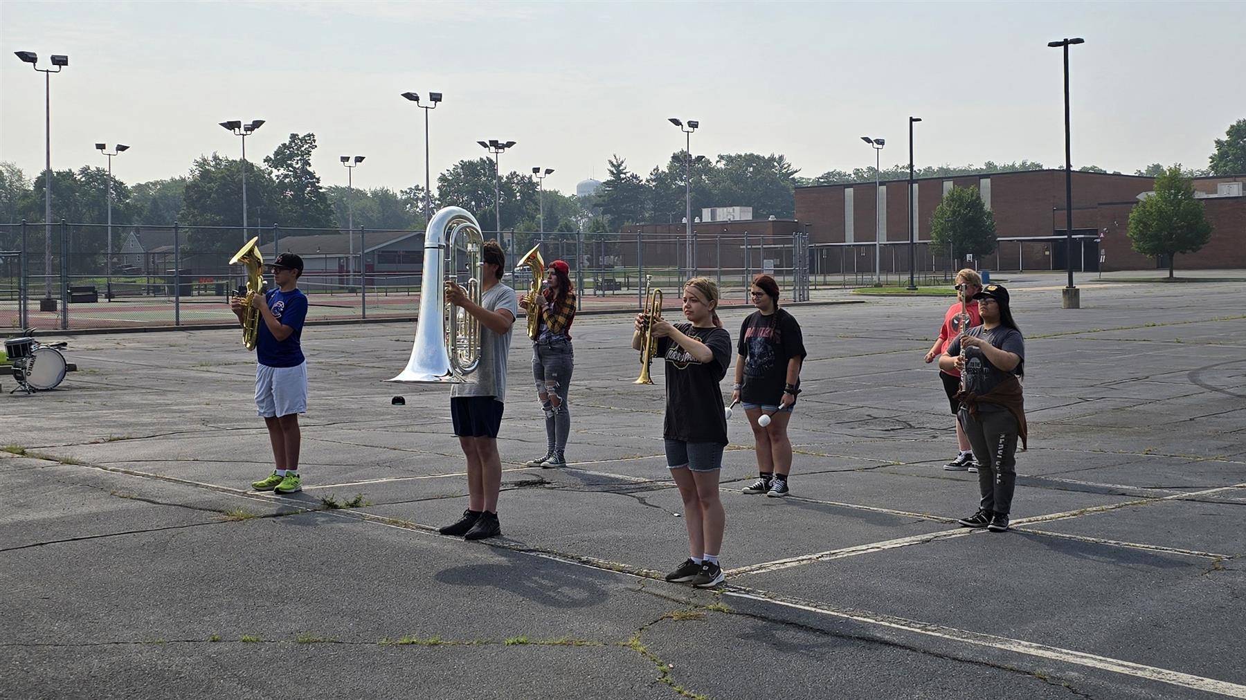 High School Band competing to see who can hold their horn correctly the longest.